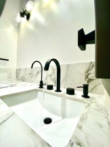 Modern black faucet and marble counter